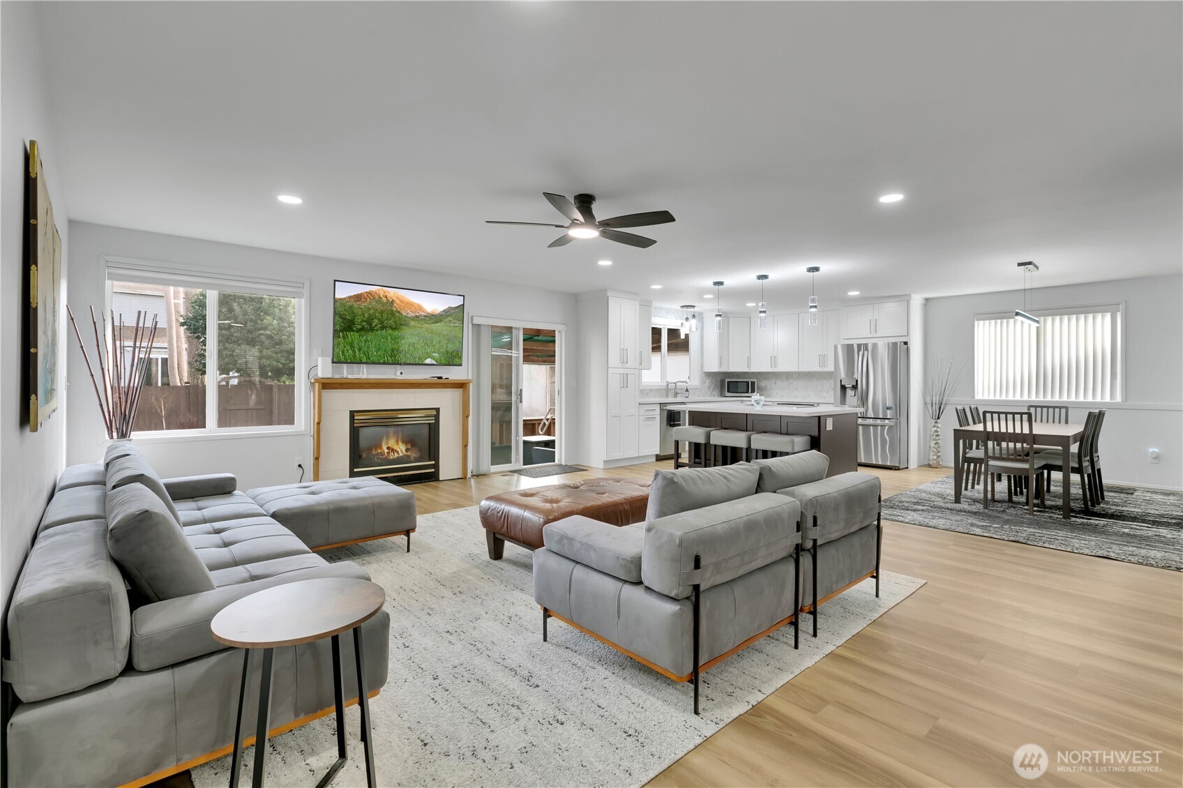 28012 236th Avenue Southeast Maple Valley, WA 98038 - Photo 5 of 39 a living room with furniture and a fireplace