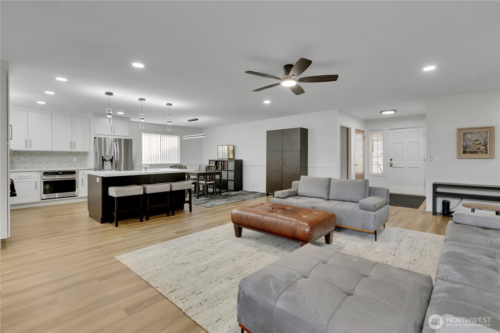 28012 236th Avenue Southeast Maple Valley, WA 98038 - Photo 8 of 39 a living room with furniture and kitchen view