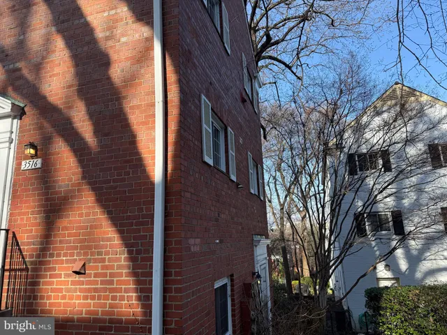 a view of a pathway with a house in the background