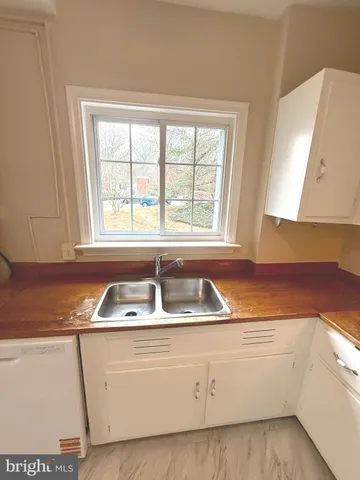 a kitchen that has a sink and a window in it