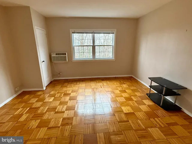 a view of an empty room and window
