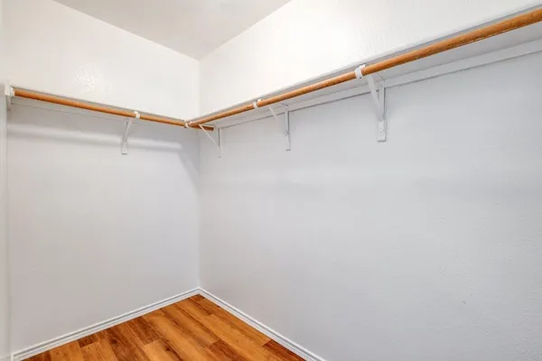 a view of a room with shelf on the wall