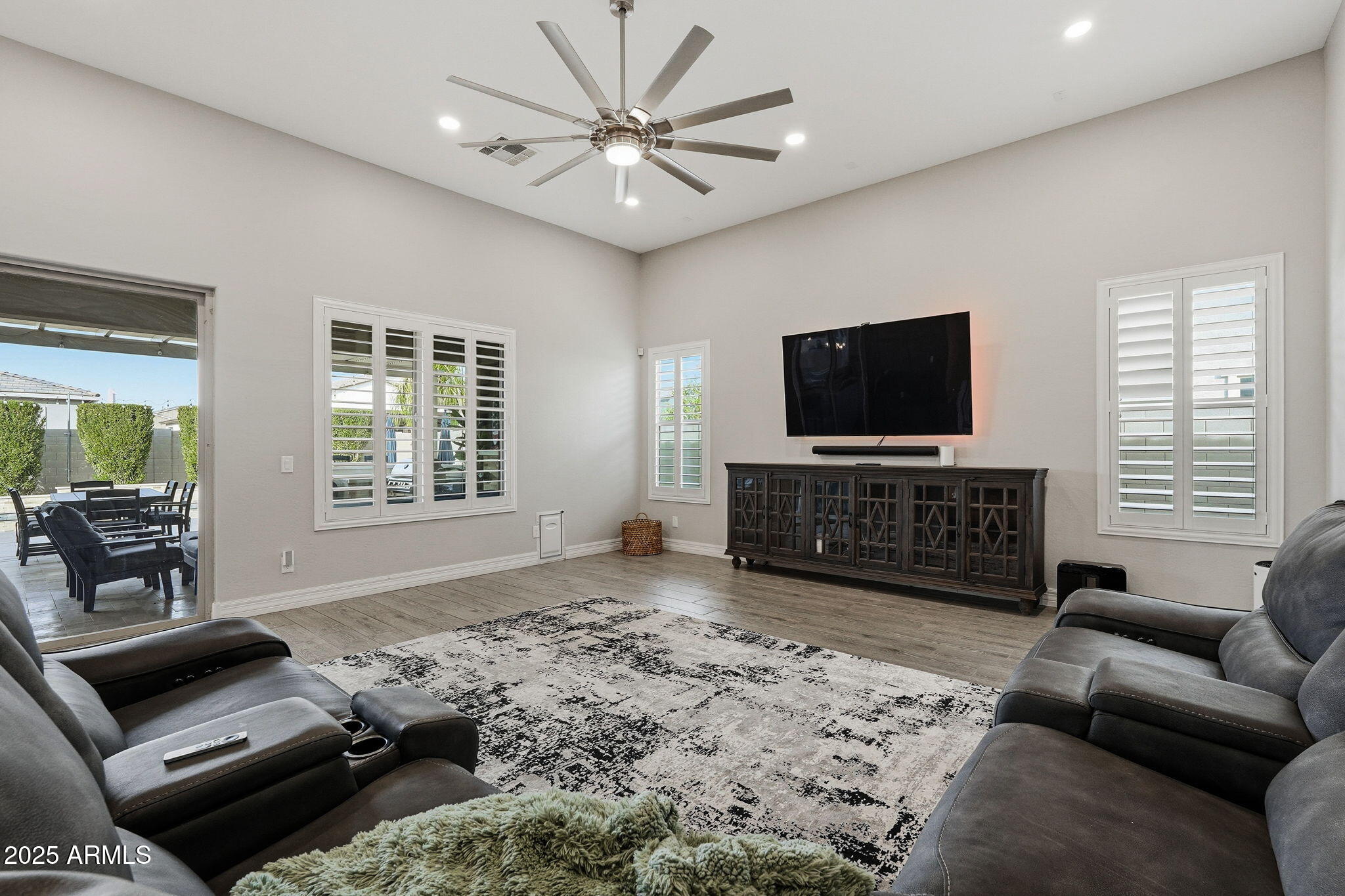 22940 East Camacho Road Queen Creek, AZ 85142 - Photo 11 of 68 a living room with furniture and a flat screen tv