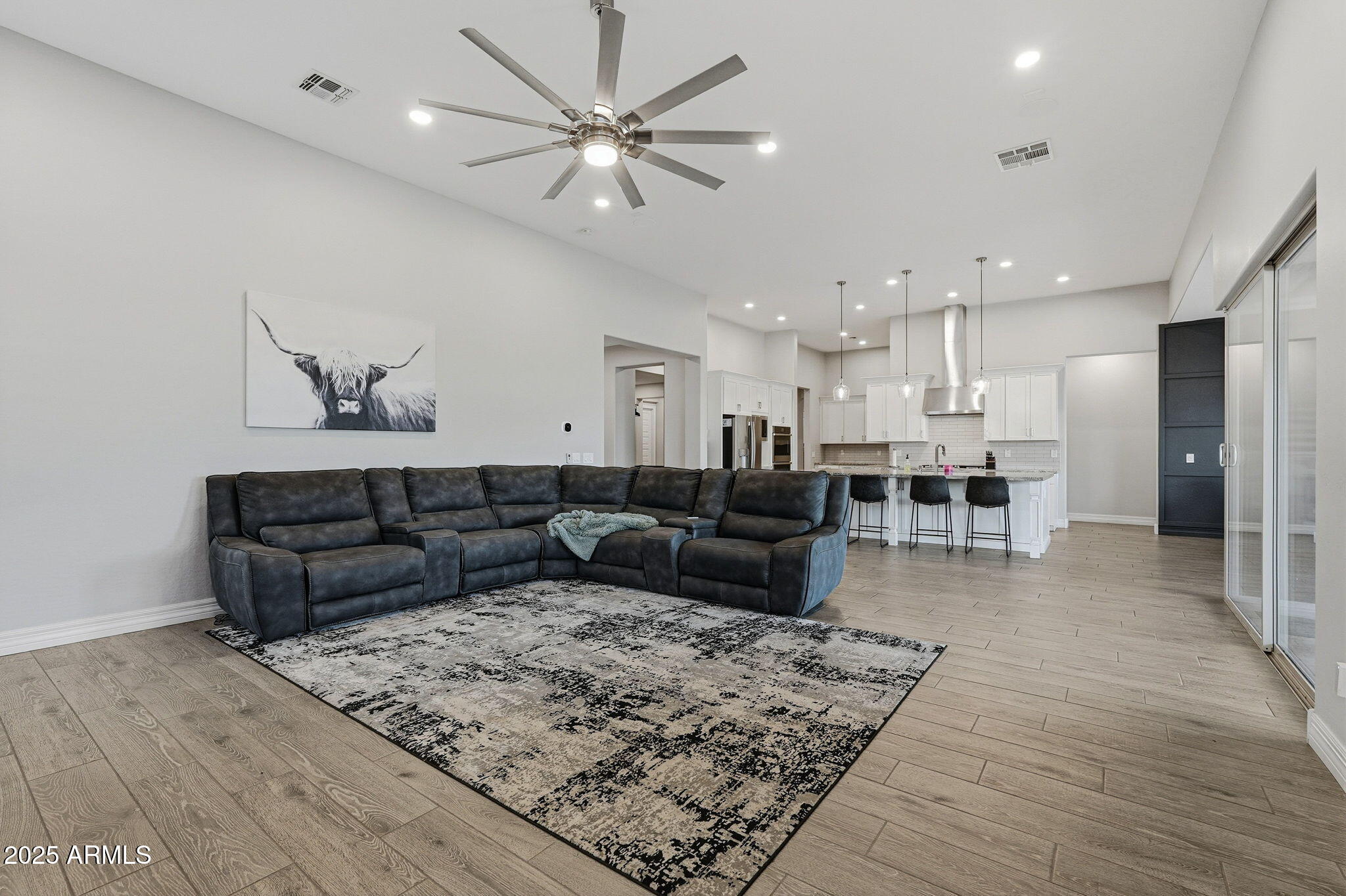 22940 East Camacho Road Queen Creek, AZ 85142 - Photo 13 of 68 a living room with furniture and wooden floor