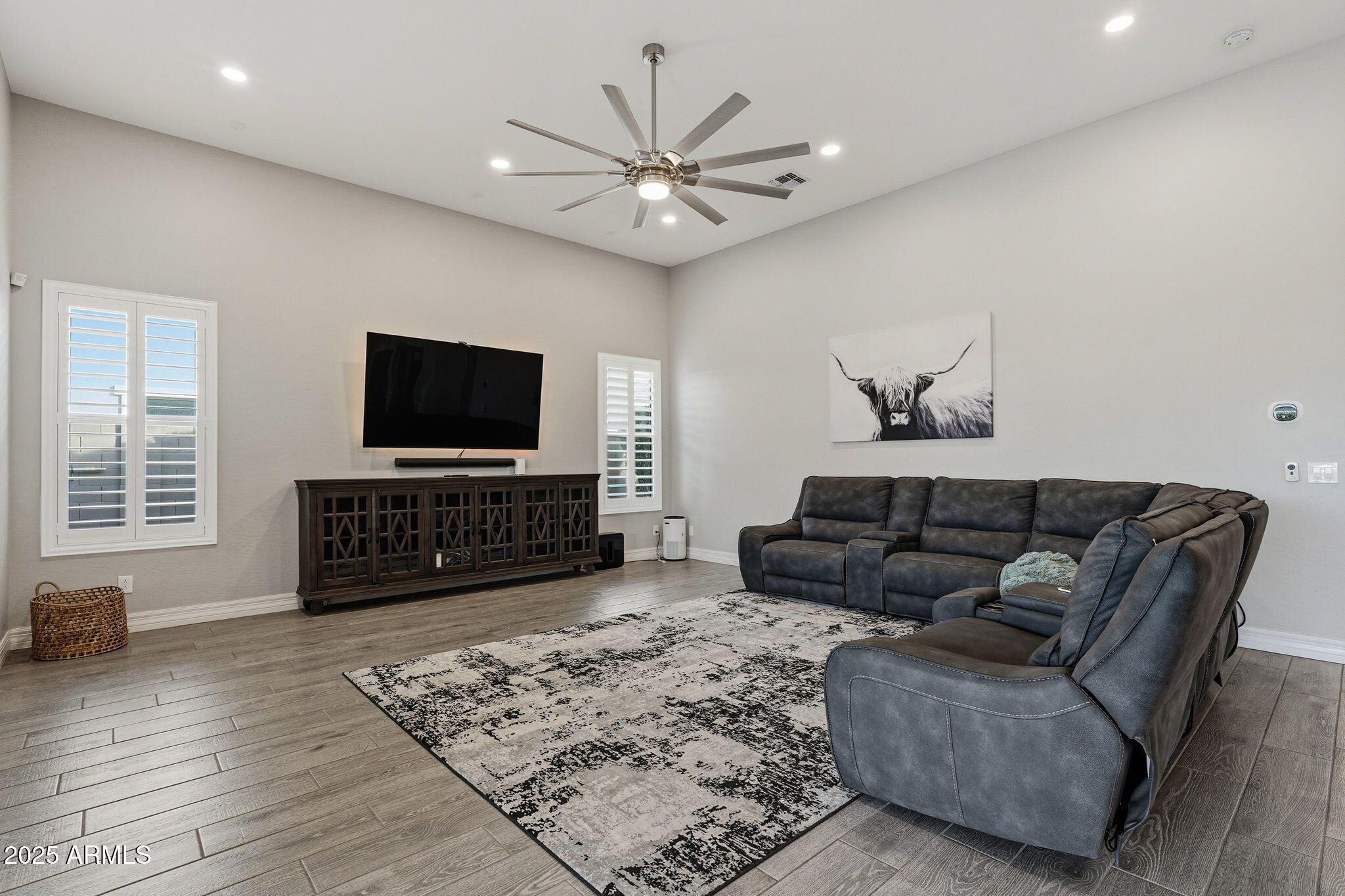 22940 East Camacho Road Queen Creek, AZ 85142 - Photo 14 of 68 a living room with furniture and a flat screen tv
