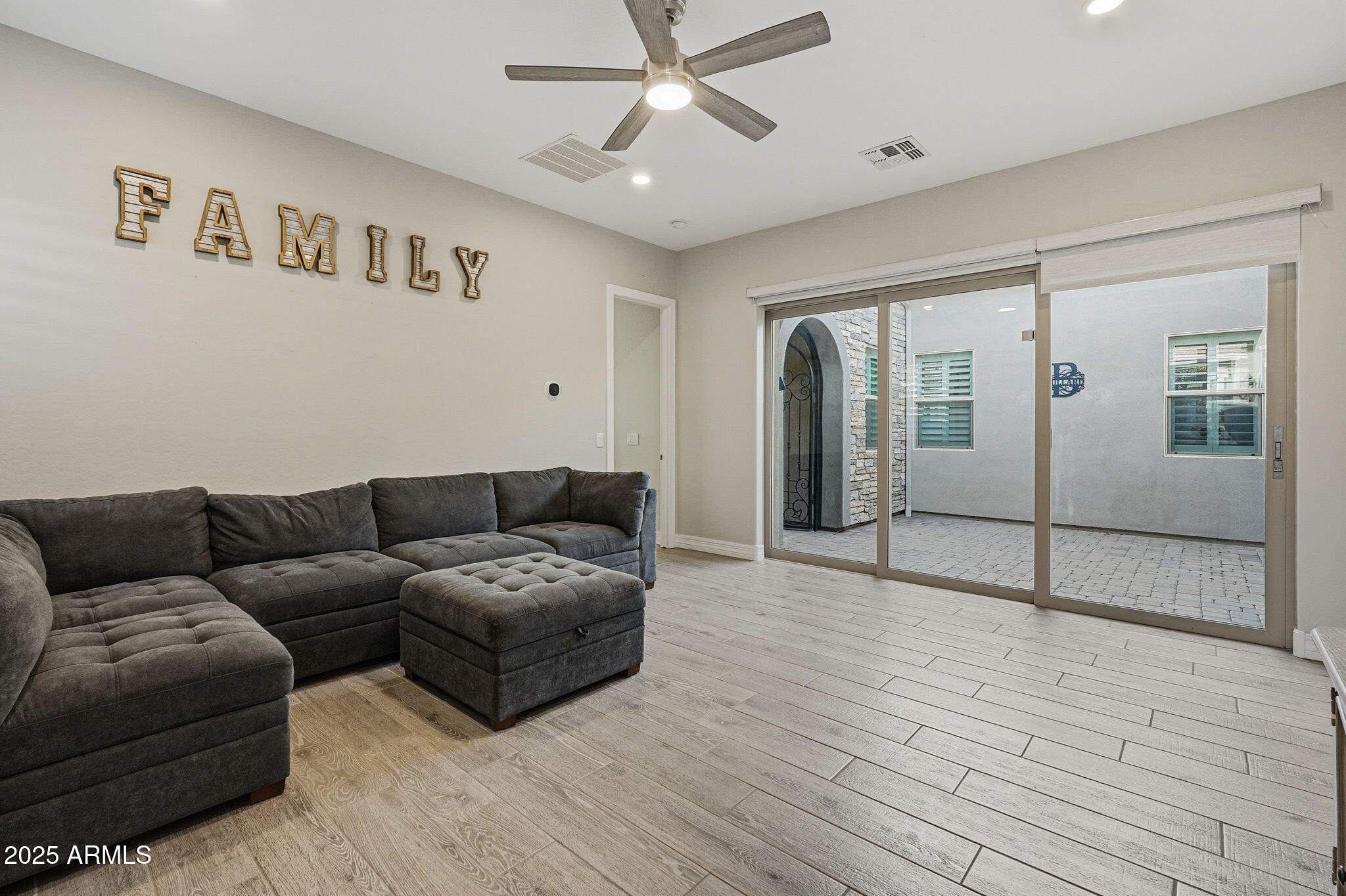 22940 East Camacho Road Queen Creek, AZ 85142 - Photo 17 of 68 a living room with furniture and wooden floor