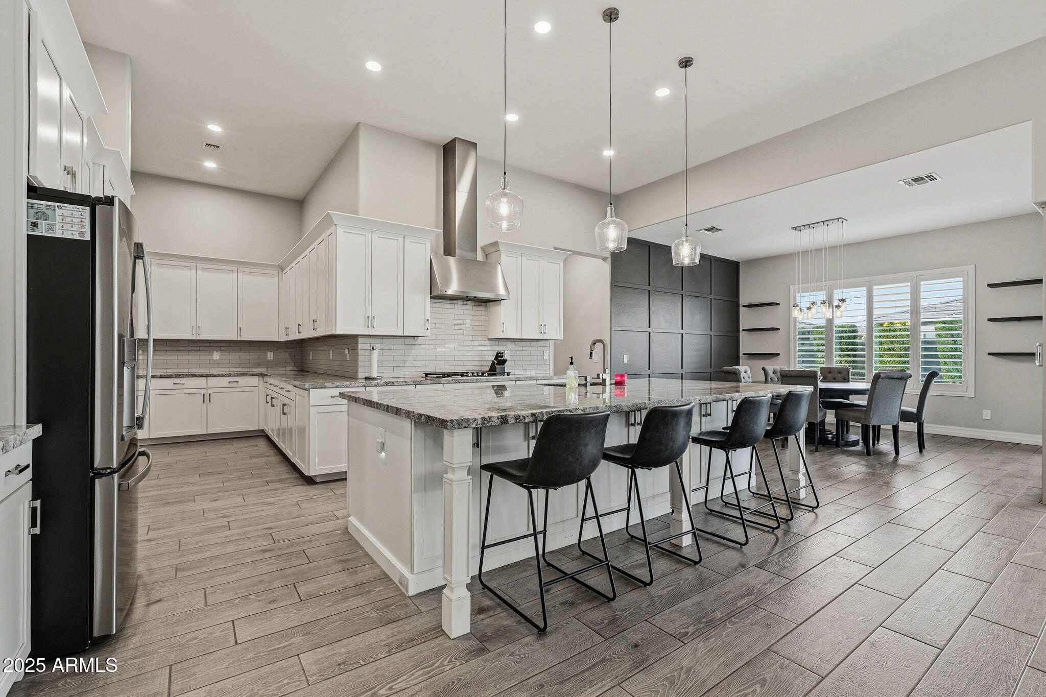 22940 East Camacho Road Queen Creek, AZ 85142 - Photo 20 of 68 a kitchen with lots of counter top space and stainless steel appliances