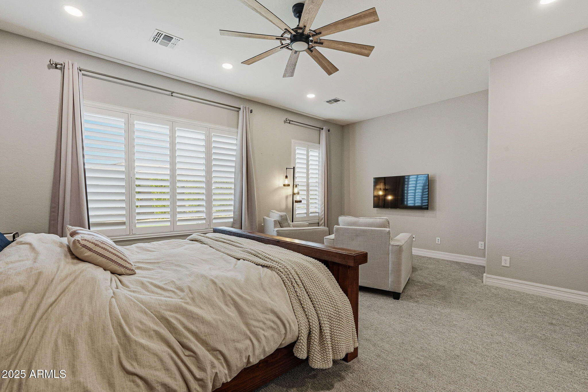 22940 East Camacho Road Queen Creek, AZ 85142 - Photo 32 of 68 a bedroom with a bed and a tv