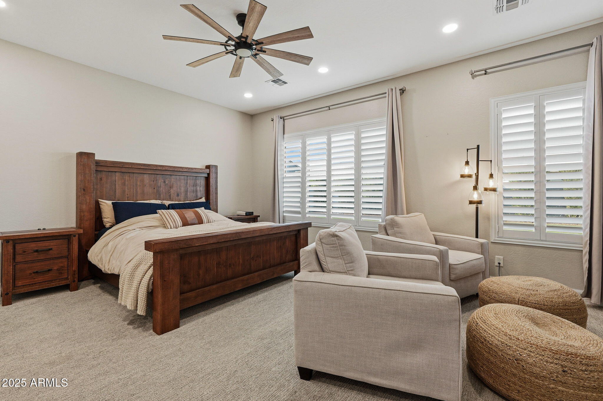 22940 East Camacho Road Queen Creek, AZ 85142 - Photo 33 of 68 a bed room with a bed and a couch