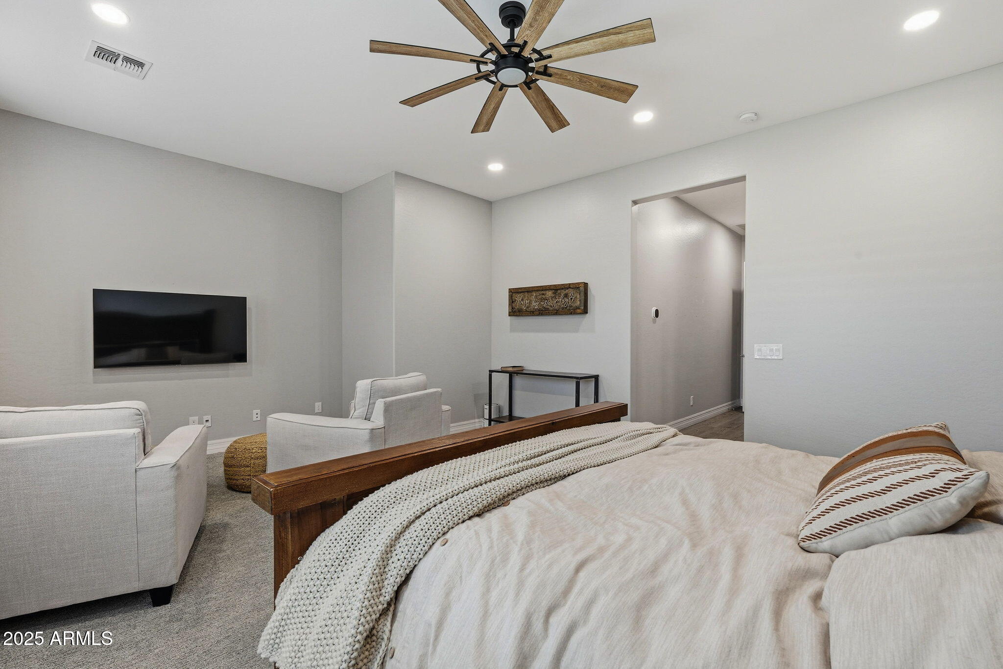 22940 East Camacho Road Queen Creek, AZ 85142 - Photo 35 of 68 a bedroom with a bed and a couch