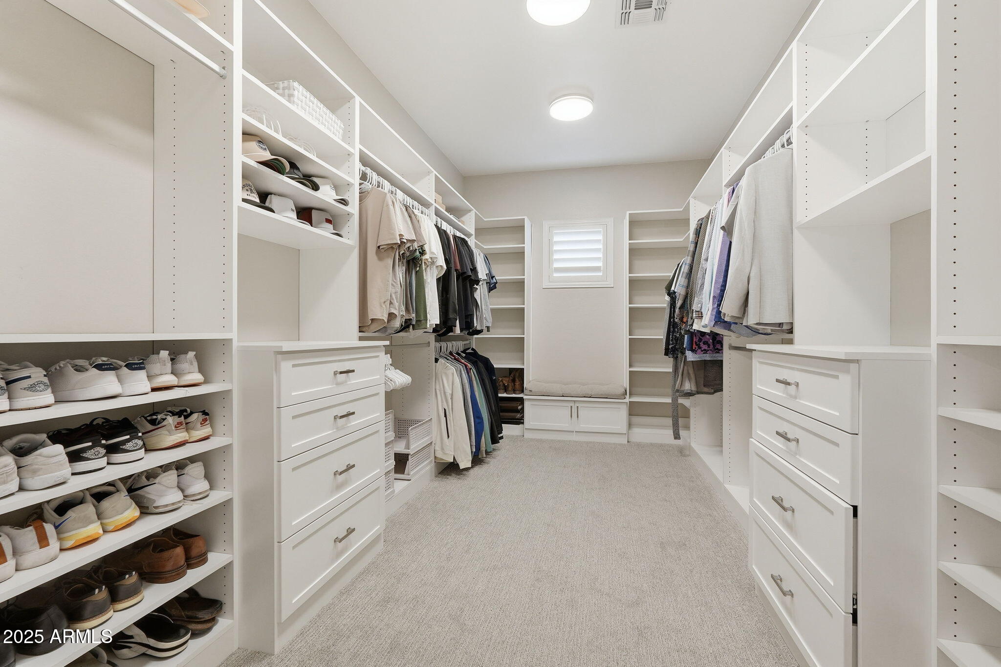 22940 East Camacho Road Queen Creek, AZ 85142 - Photo 36 of 68 a view of walk in closet with clothes and shoes