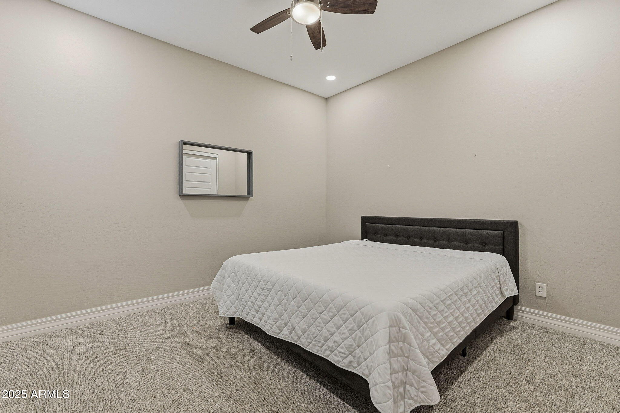 22940 East Camacho Road Queen Creek, AZ 85142 - Photo 44 of 68 a bedroom with a bed and ceiling fan