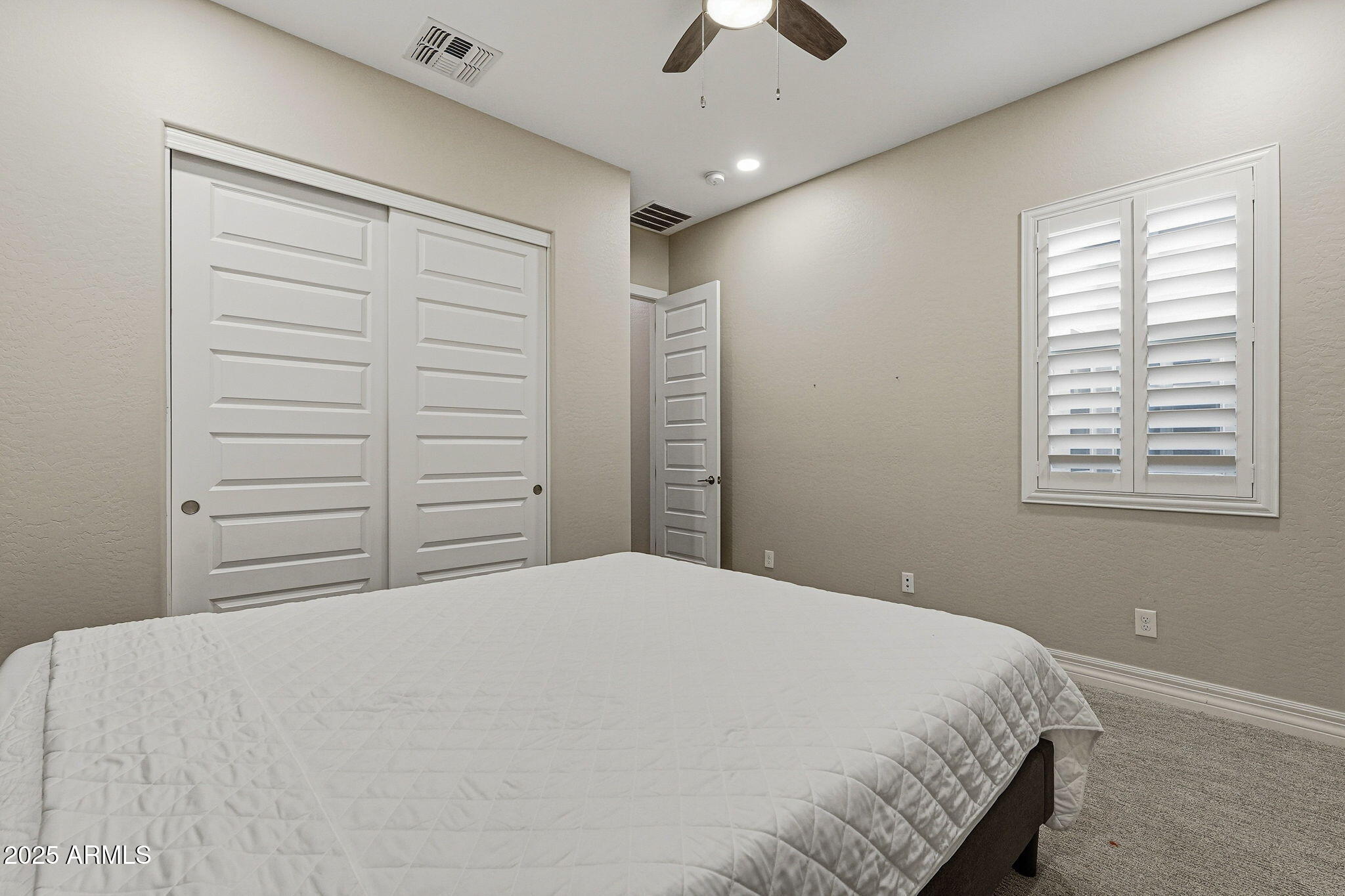 22940 East Camacho Road Queen Creek, AZ 85142 - Photo 45 of 68 a bedroom with a bed and a window