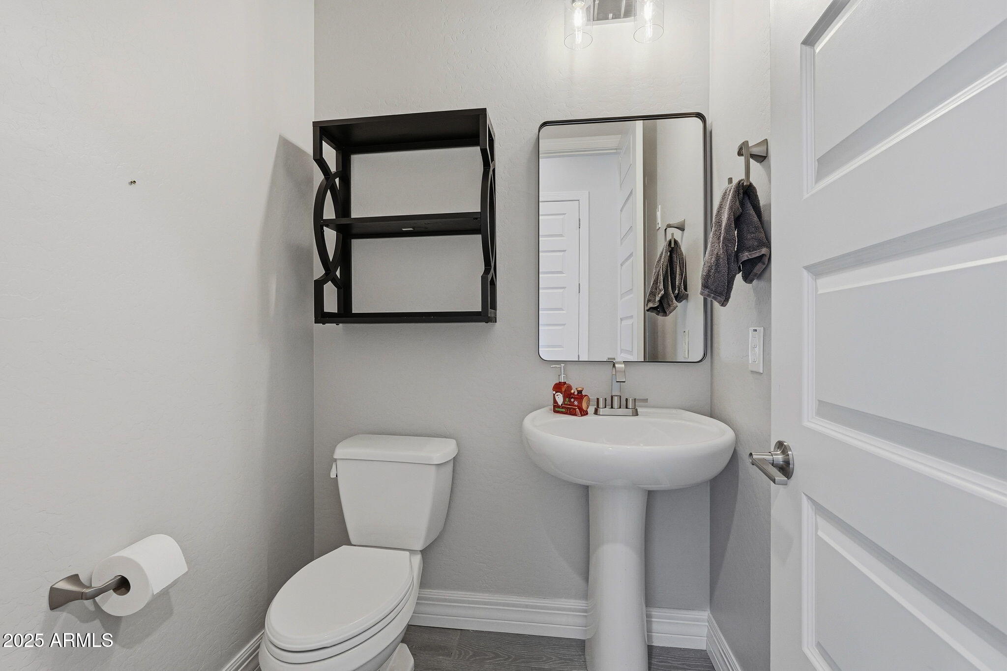 22940 East Camacho Road Queen Creek, AZ 85142 - Photo 47 of 68 a bathroom with a toilet sink and mirror