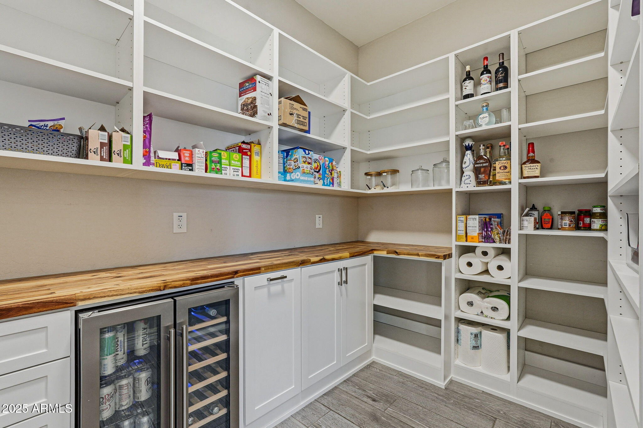 22940 East Camacho Road Queen Creek, AZ 85142 - Photo 51 of 68 a view of kitchen cabinets with wooden floor and cabinets