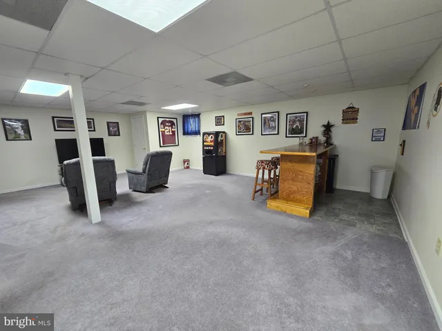 a bed room with furniture and window