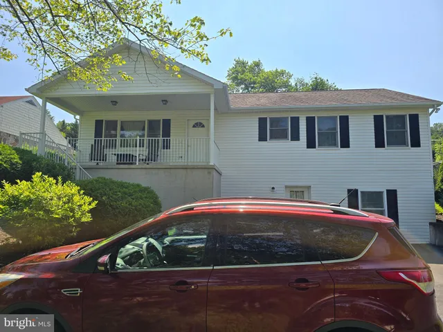 a front view of a house with yard
