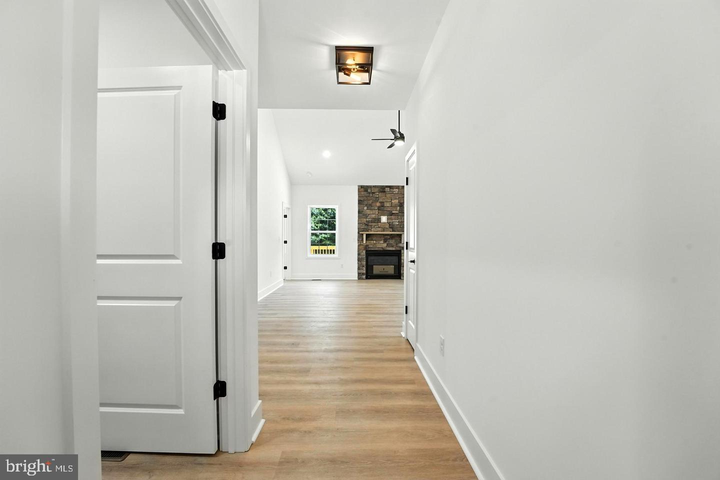 10704 Rixeyville Road Culpeper, VA 22701 - Photo 11 of 35 a view of a hallway with wooden floor and closet