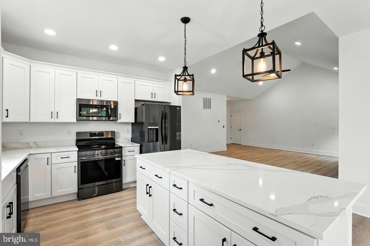 10704 Rixeyville Road Culpeper, VA 22701 - Photo 16 of 35 a kitchen with stainless steel appliances a refrigerator sink and microwave