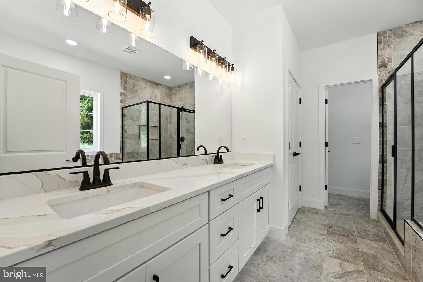 10704 Rixeyville Road Culpeper, VA 22701 - Photo 24 of 35 a bathroom with a double vanity sink mirror and double