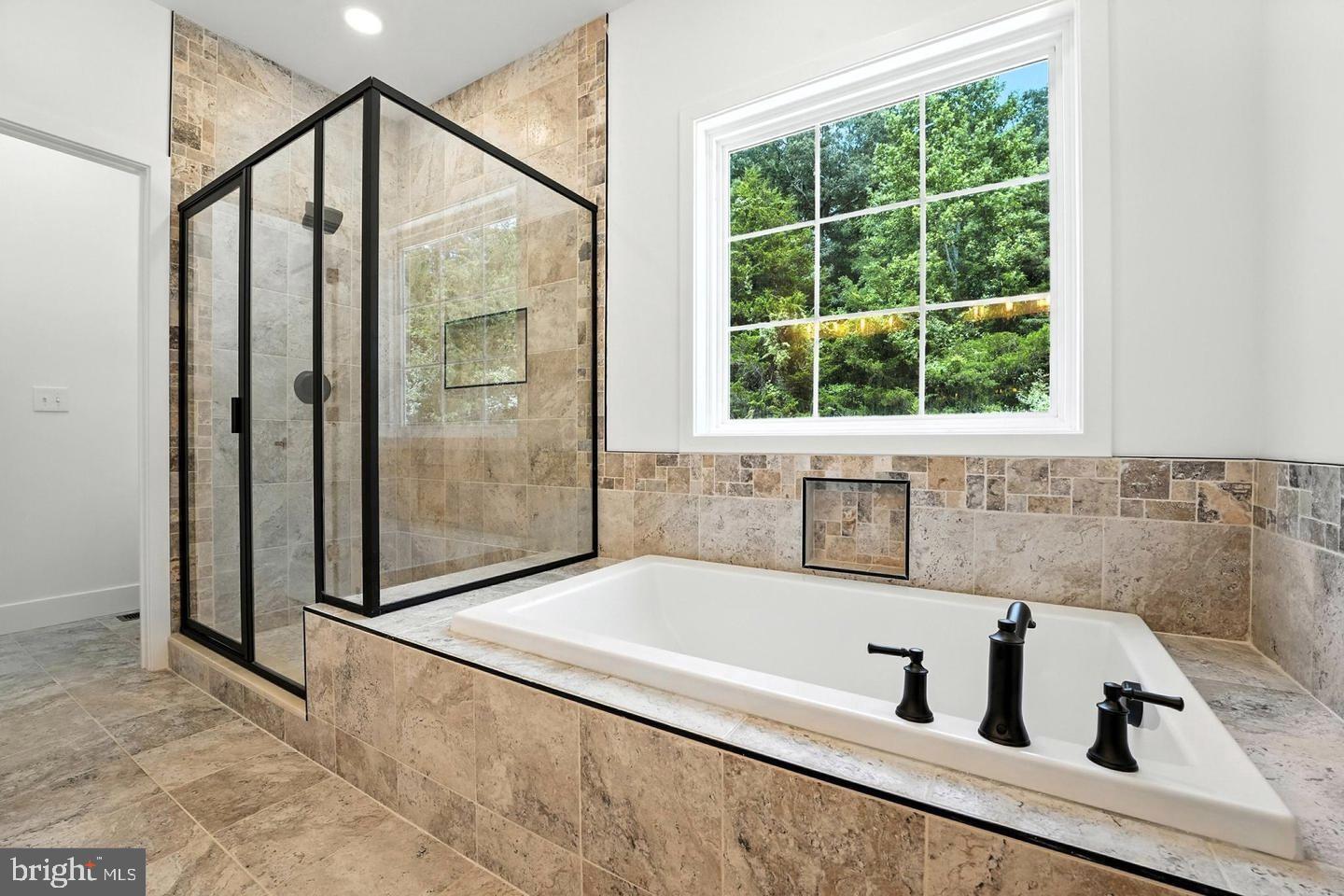 10704 Rixeyville Road Culpeper, VA 22701 - Photo 25 of 35 a bathroom with a tub and shower