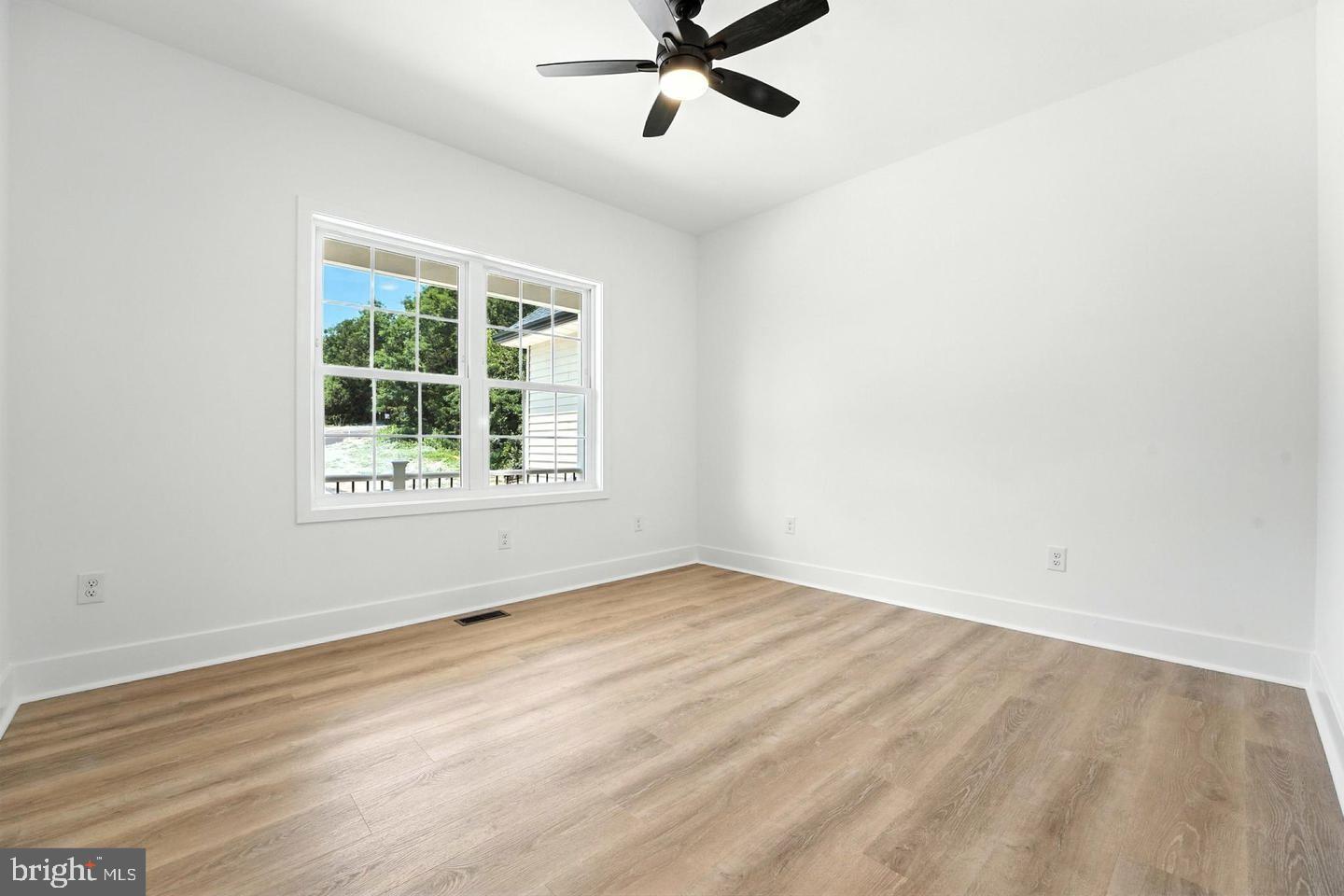 10704 Rixeyville Road Culpeper, VA 22701 - Photo 31 of 35 an empty room with window and ceiling fan