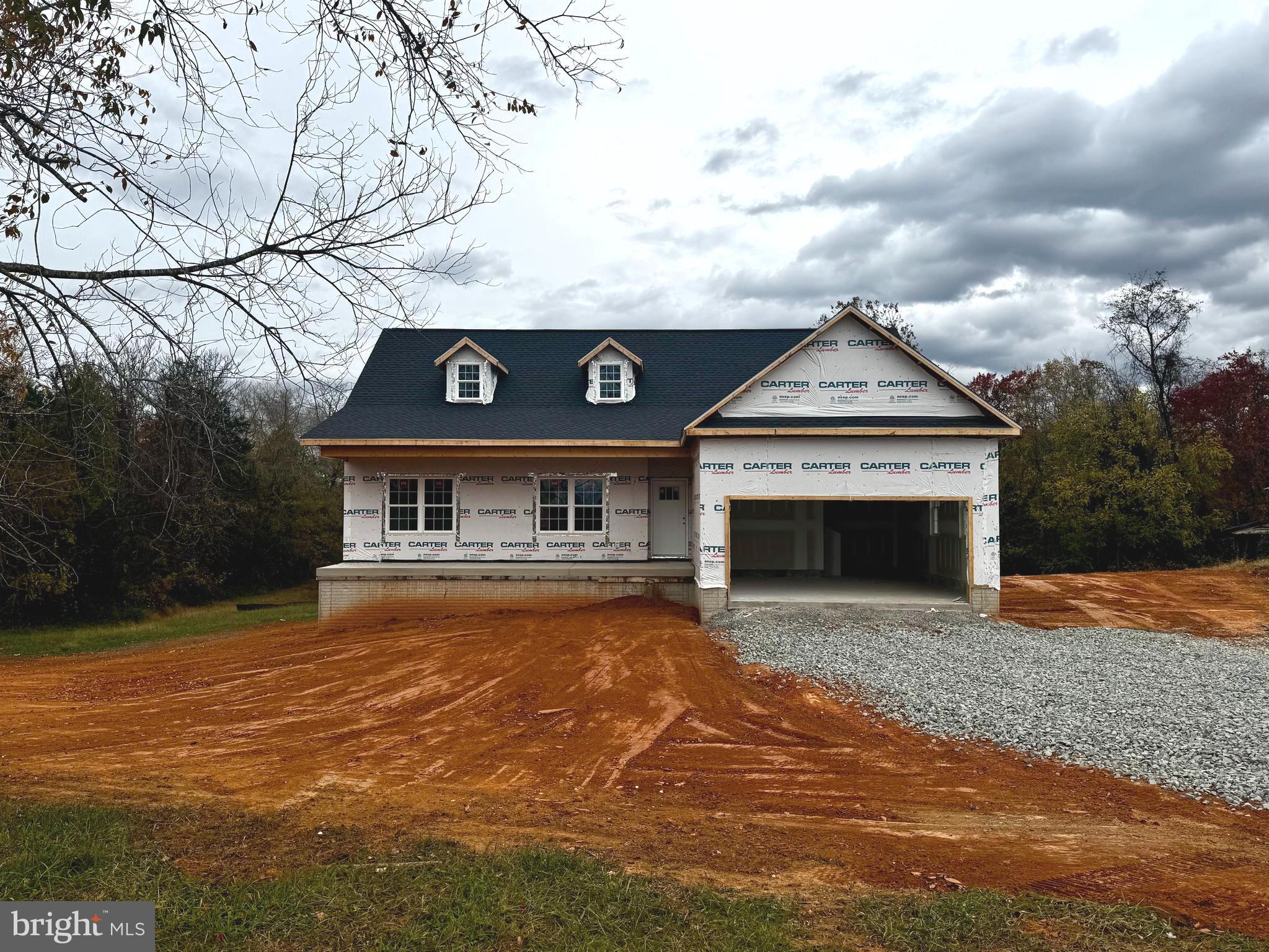 10704 Rixeyville Road Culpeper, VA 22701 - Photo 5 of 35 a front view of a house with yard