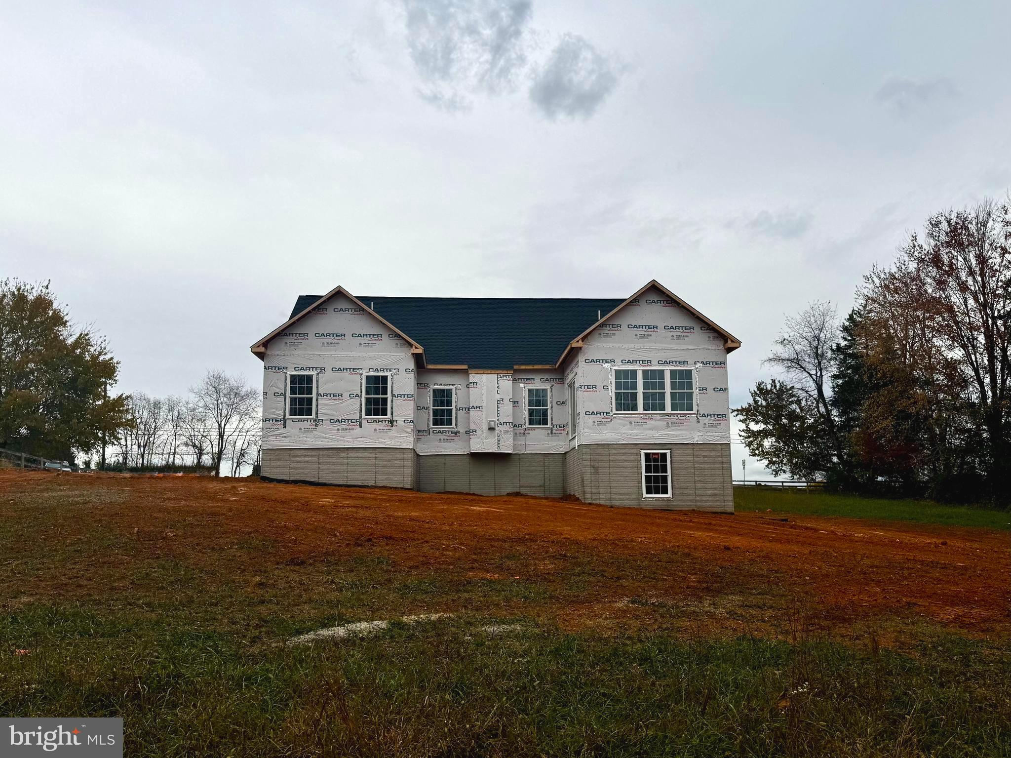 10704 Rixeyville Road Culpeper, VA 22701 - Photo 8 of 35 a front view of a house with a yard and garage