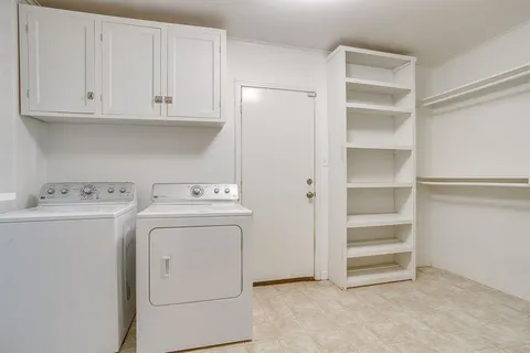 a view of storage and utility room with washer and dryer