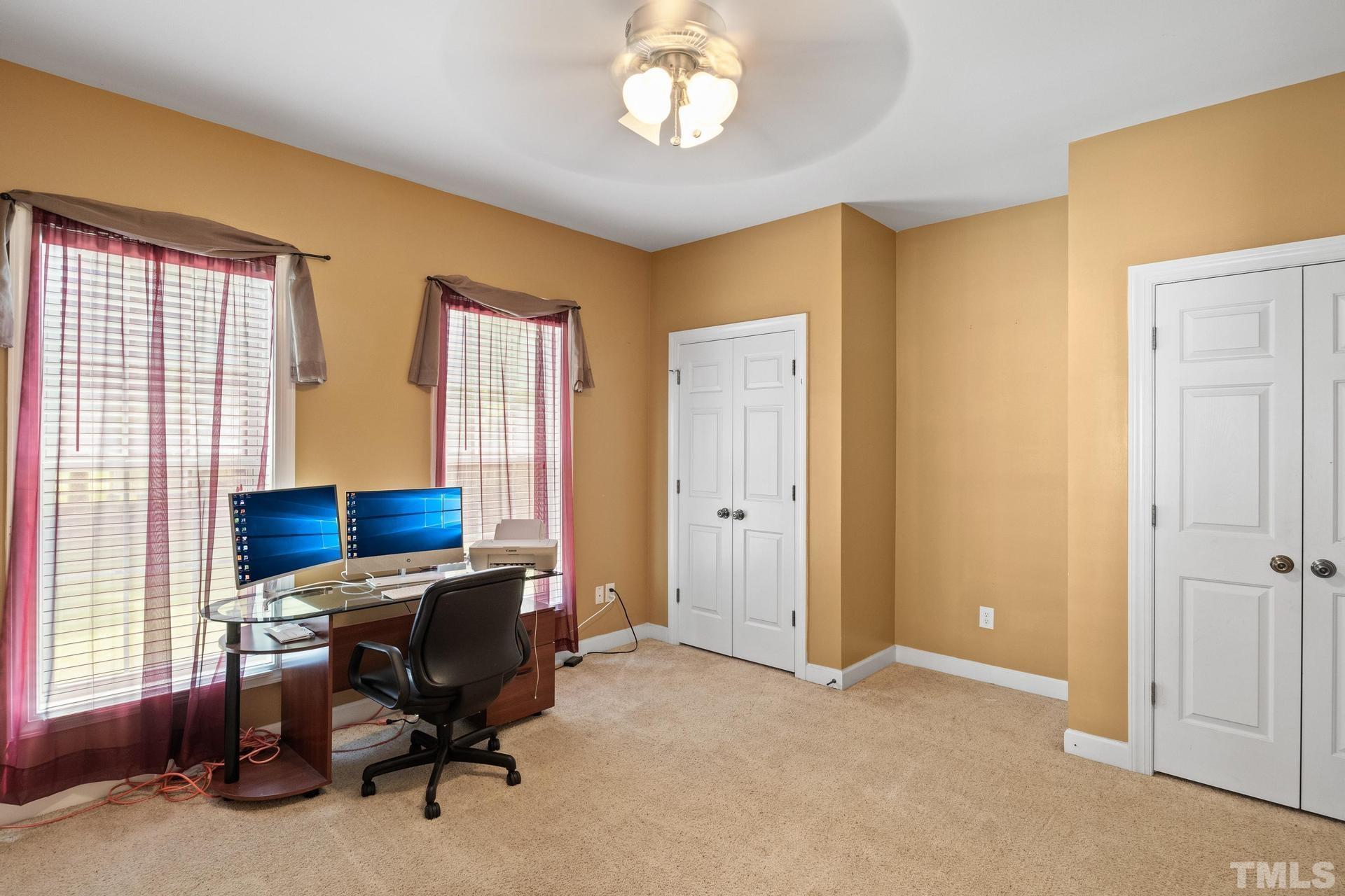 836 Crown Crossing Lane Raleigh, NC 27610 - Photo 20 of 31 a view of a livingroom with workspace and a window