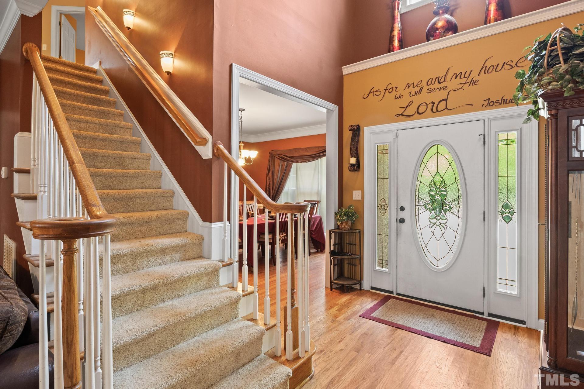 836 Crown Crossing Lane Raleigh, NC 27610 - Photo 6 of 31 a view of an entryway with wooden floor