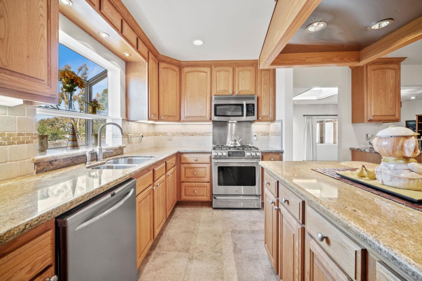 3060 Eddy Circle Marina, CA 93933 - Photo 4 of 35 a kitchen with stainless steel appliances granite countertop a sink stove and refrigerator