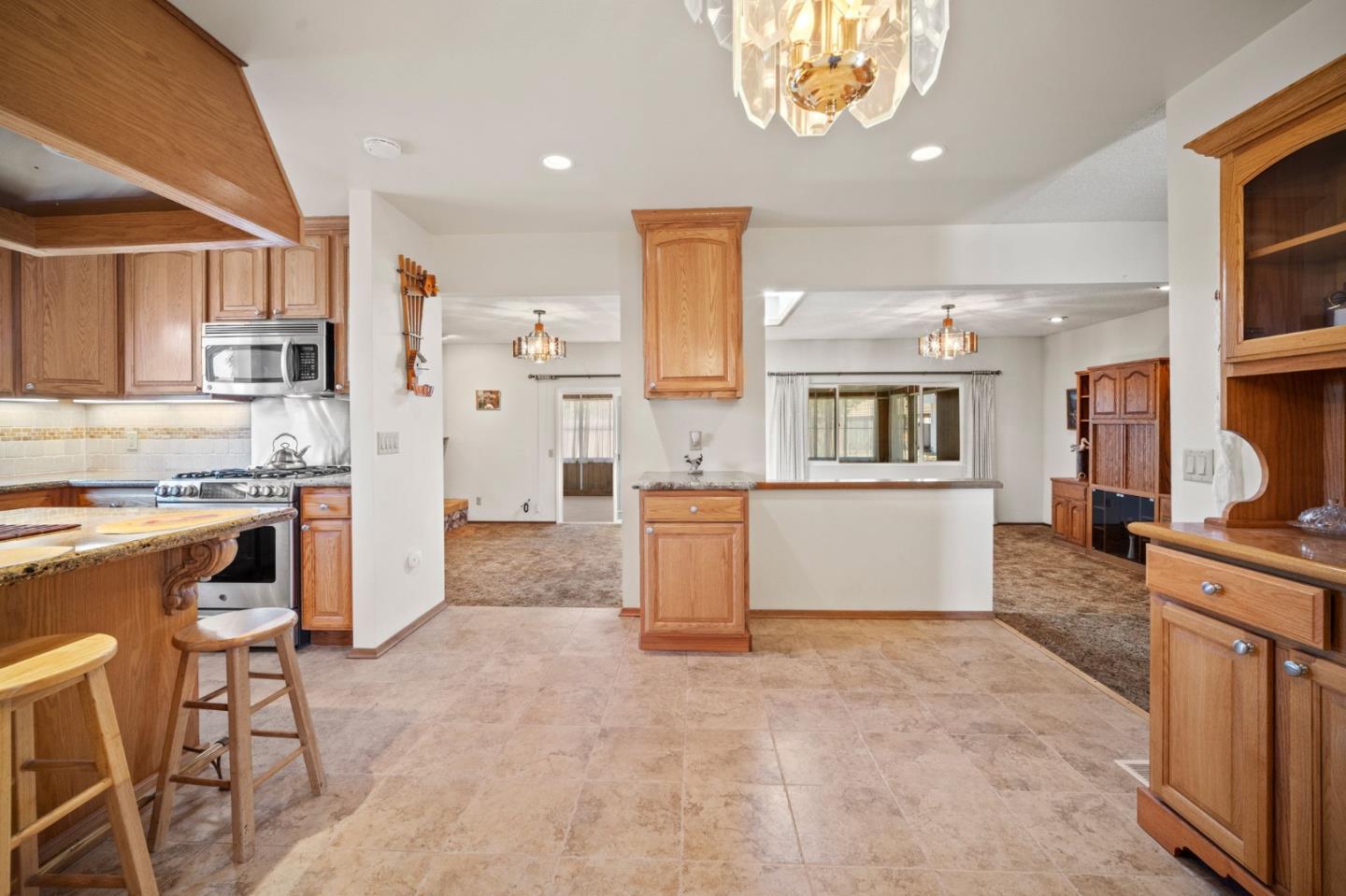 3060 Eddy Circle Marina, CA 93933 - Photo 8 of 35 a kitchen with a refrigerator and a stove top oven
