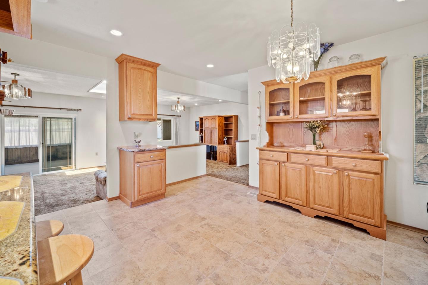 3060 Eddy Circle Marina, CA 93933 - Photo 9 of 35 a large white kitchen with cabinets and outdoor living room