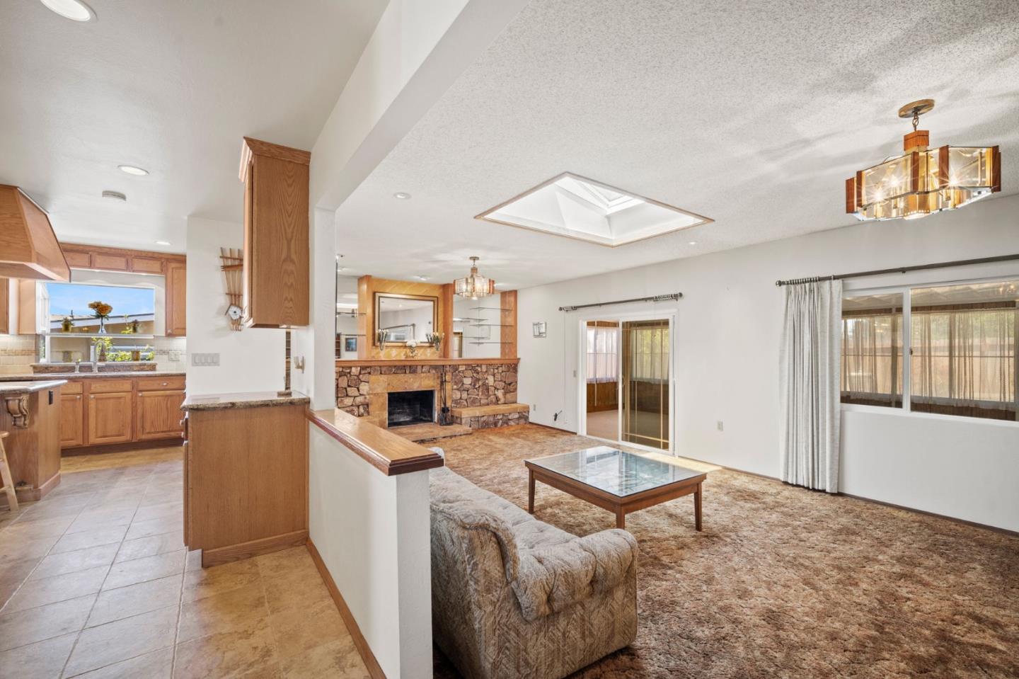 3060 Eddy Circle Marina, CA 93933 - Photo 10 of 35 a living room with stainless steel appliances furniture a rug and a kitchen