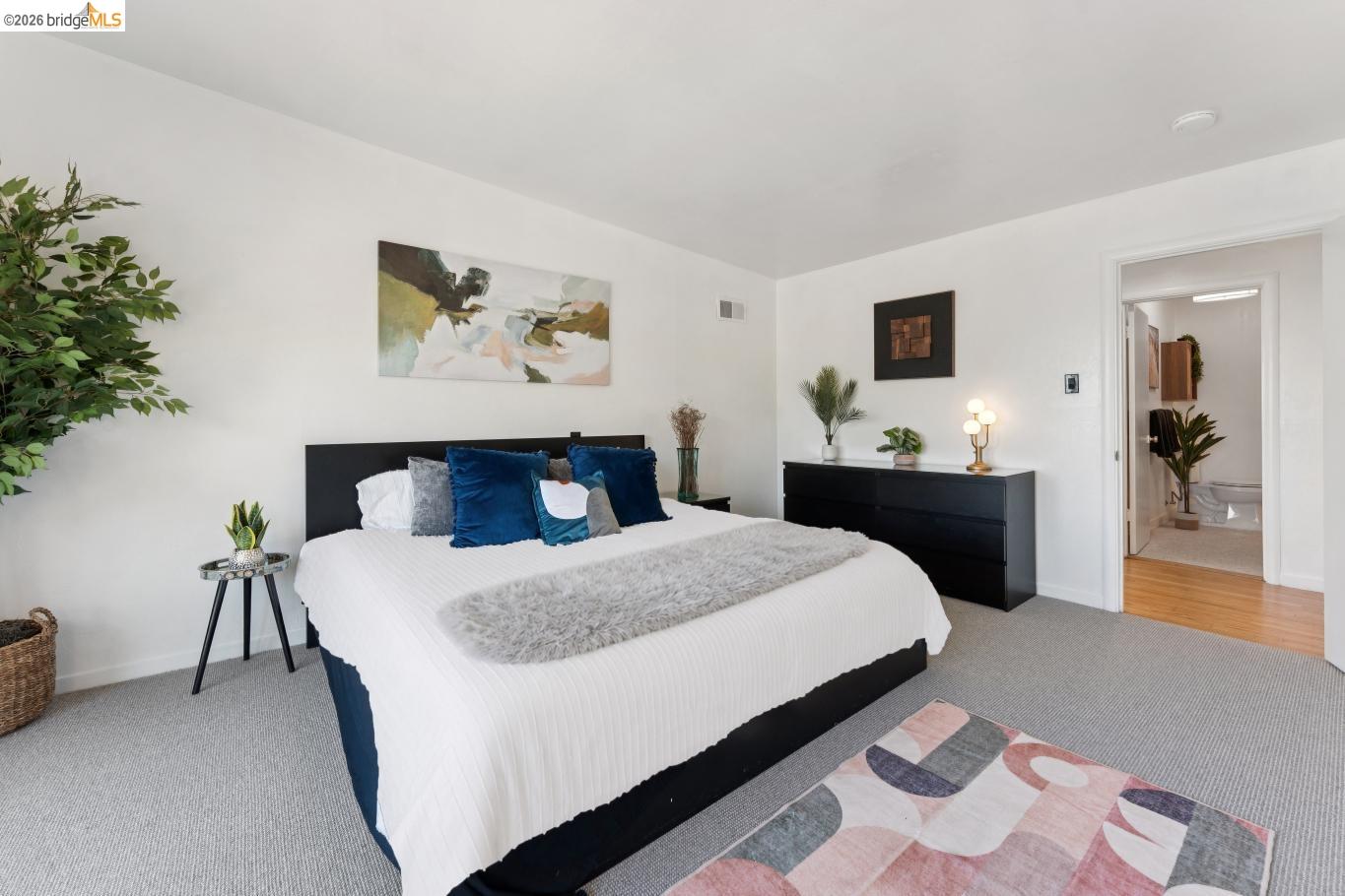 2301 Oak Street Berkeley, CA 94708 - Photo 18 of 61 Bright bedroom space featuring light gray carpeting, crisp white walls, and a recessed ceiling light