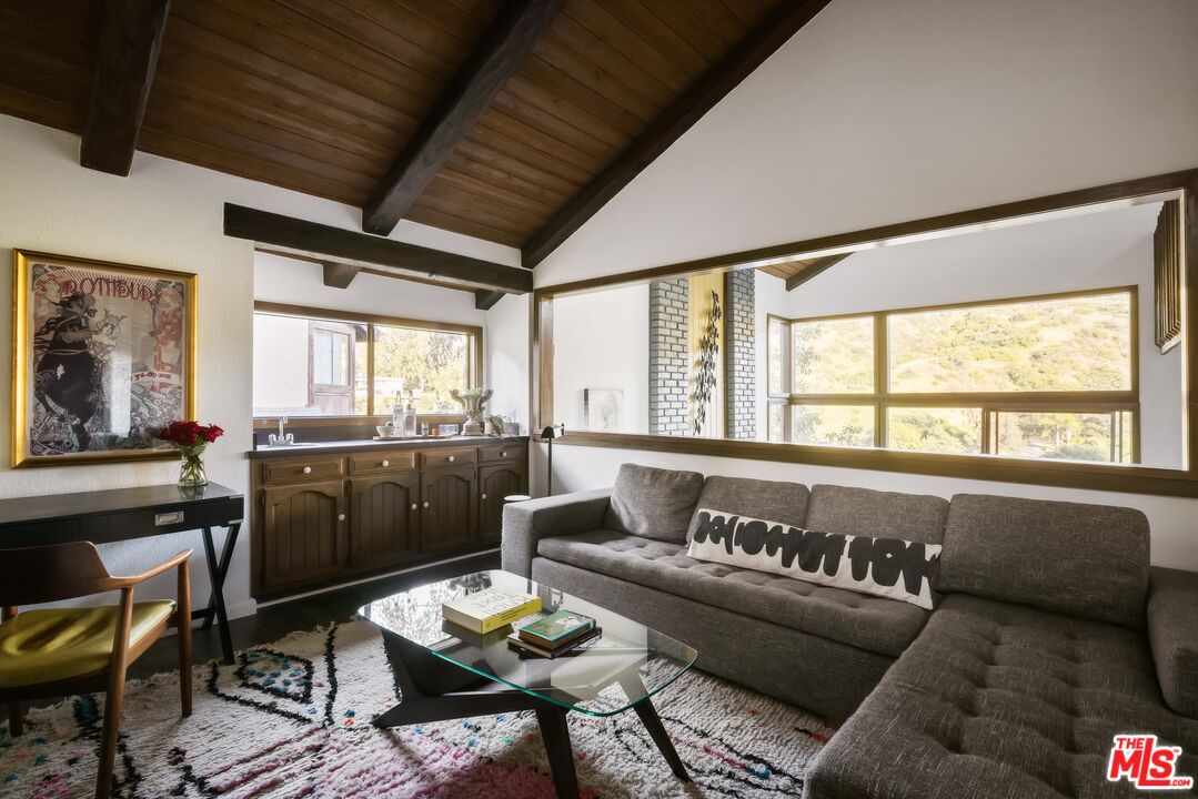 2690 Kennington Drive Glendale, CA 91206 - Photo 17 of 50 a living room with furniture and a large window