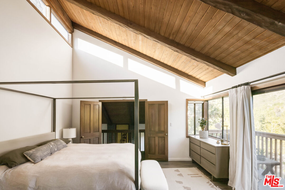 2690 Kennington Drive Glendale, CA 91206 - Photo 23 of 50 a bedroom with a bed and glass door