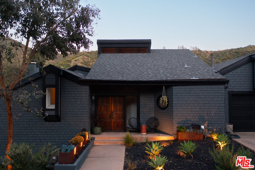 2690 Kennington Drive Glendale, CA 91206 - Photo 3 of 50 a front view of a house with garden
