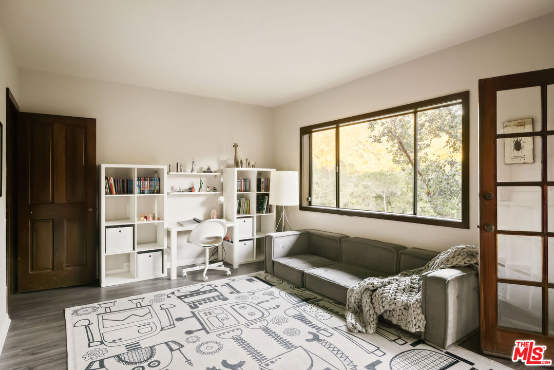 2690 Kennington Drive Glendale, CA 91206 - Photo 36 of 50 a living room with furniture and a window