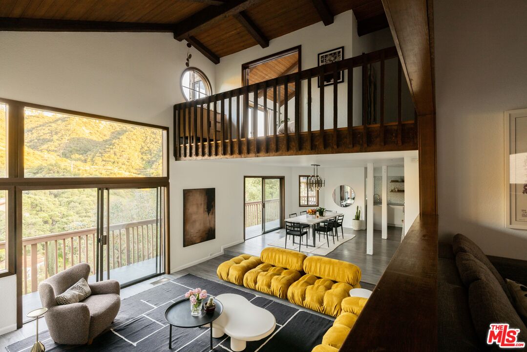 2690 Kennington Drive Glendale, CA 91206 - Photo 4 of 50 a view of a living room with furniture a fireplace and wooden floor