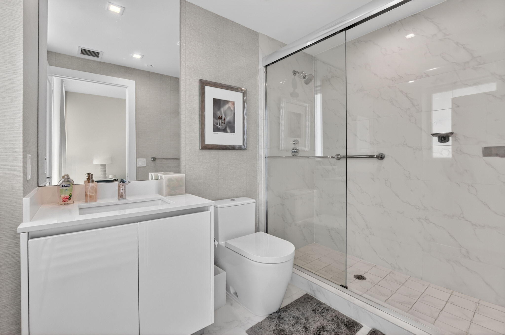 20155 Boca W Drive, Unit B701 Boca Raton, FL 33434 - Photo 29 of 78 a bathroom with a toilet a sink and shower