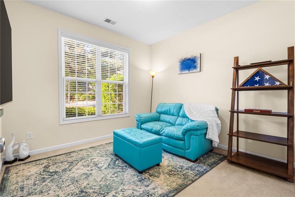 825 Lincoln Square Locust Grove, GA 30248 - Photo 23 of 29 a living room with furniture and a window