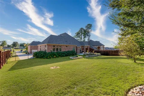 a front view of house with yard and outdoor seating
