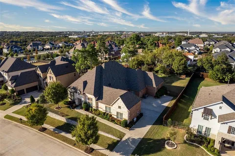 an aerial view of houses with outdoor space