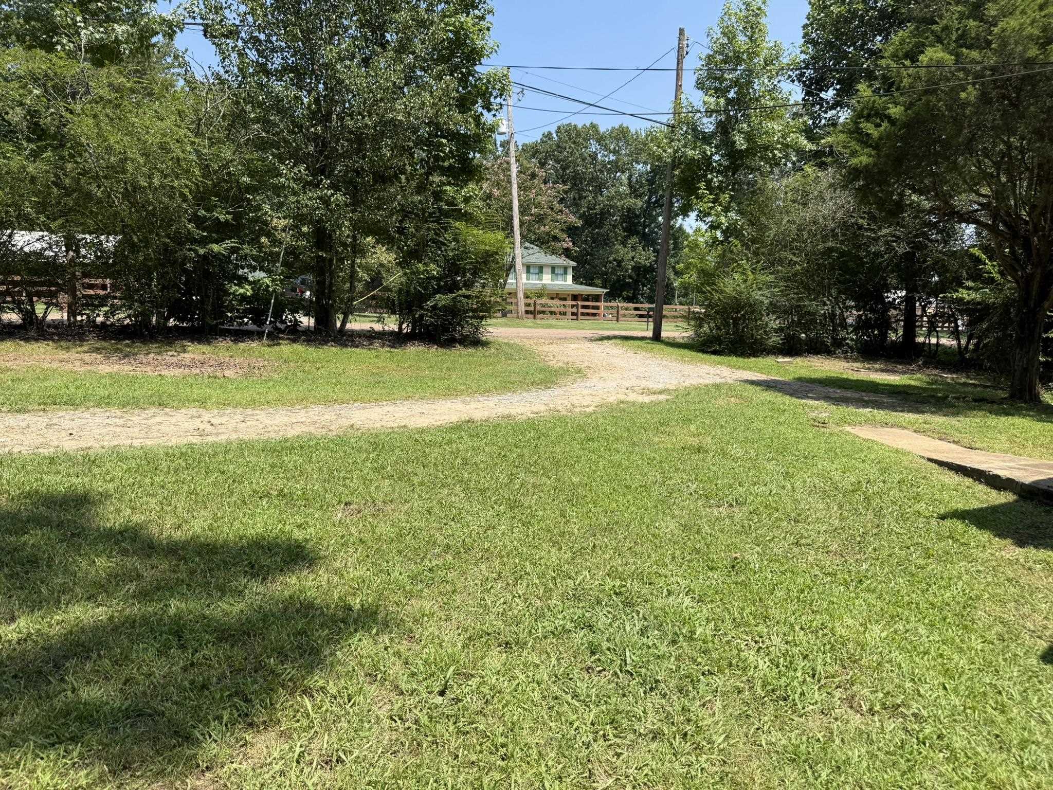 7503 Walsh Road Millington, TN 38053 - Photo 20 of 27 Expansive grounds featuring mature trees and lush, level lawn with fencing