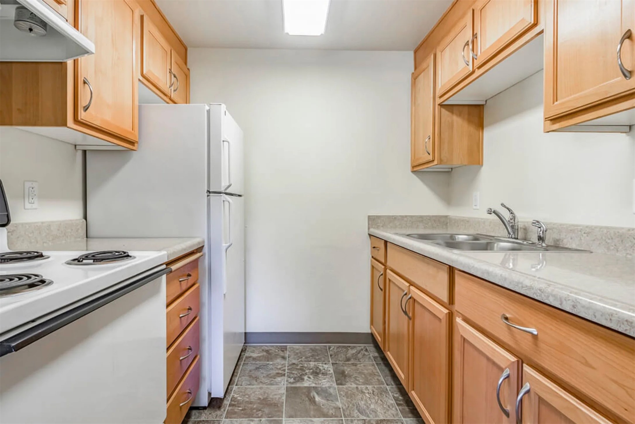 855 Northeast Hill Way Estacada, OR 97023 - Photo 8 of 10 a kitchen with a sink stove and cabinets
