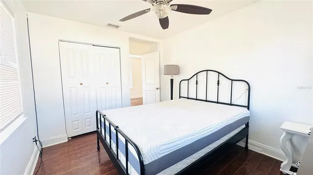 a bedroom with a bed and a dresser