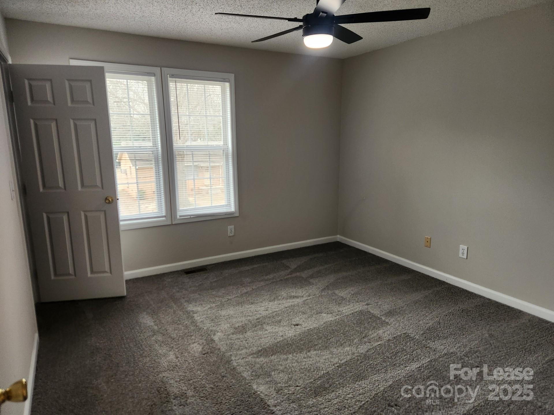 157 Pounds Avenue Southwest Concord, NC 28025 - Photo 6 of 15 an empty room with a window