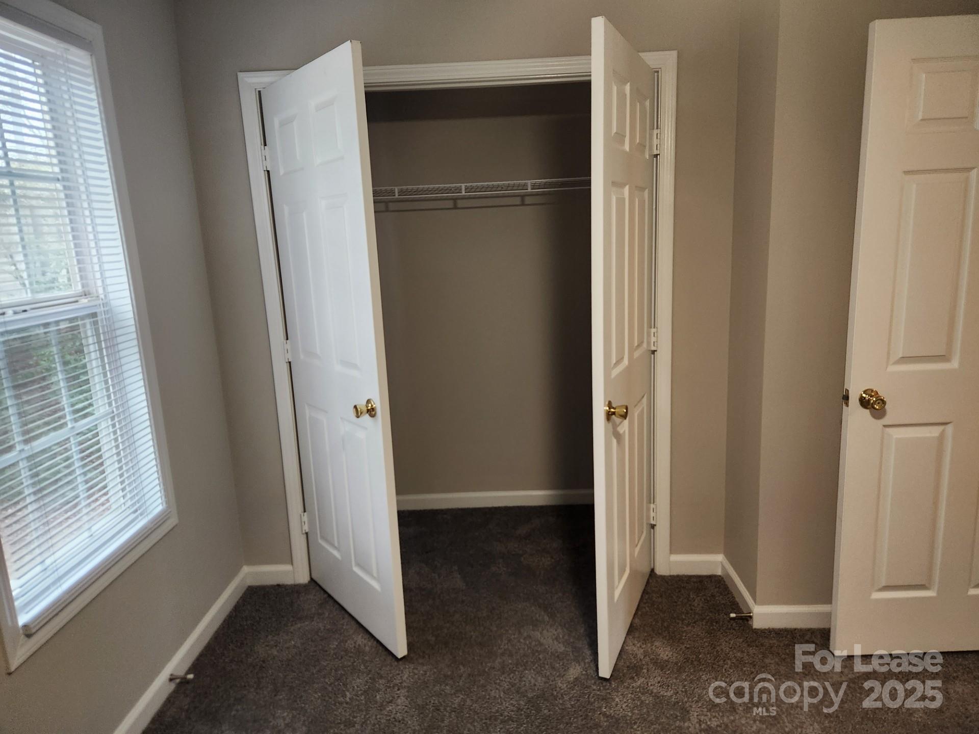 157 Pounds Avenue Southwest Concord, NC 28025 - Photo 7 of 15 a view of entryway with refrigerator and cabinet